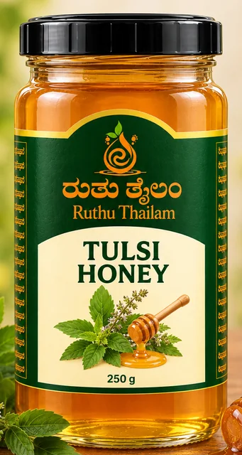 Jar of tulsi honey with tulsi leaves and a honey dipper