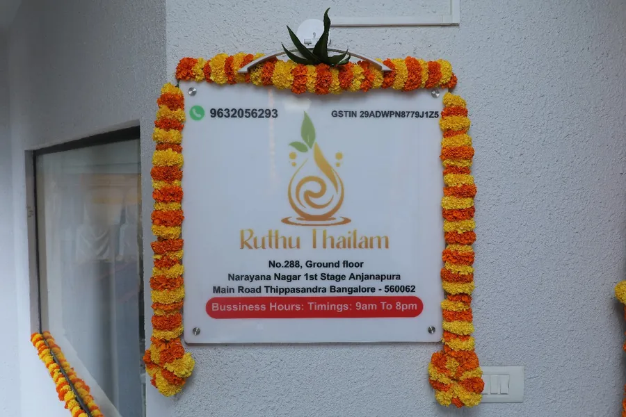 Ruthu Thailam signboard with address and business hours
